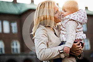 Happy family moments of mom and toddler. Childhood and motherhood care.