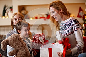 happy family moments â€“family at Christmas opening gifts together.