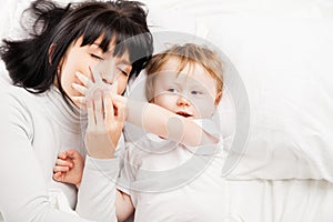 Happy family. Mother with baby playing and smiling