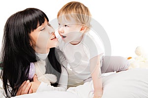 Happy family. Mother with baby playing and smiling