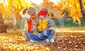Happy family mother and baby son on autumn walk
