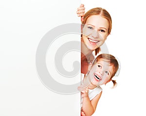 Happy family mother child daughter with blank white poster