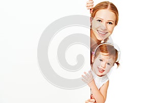 Happy family mother child daughter with blank white poster