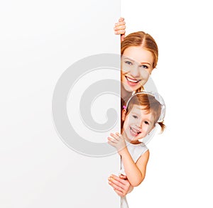 Happy family mother child daughter with blank white poster