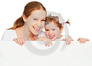 Happy family mother child daughter with blank white poster