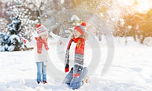 Happy family mother and child daughter having fun, playing at wi