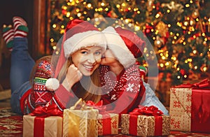 Happy family mother and child girl with Christmas present