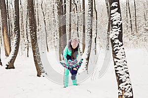 Happy family. Mother and child girl on a winter walk in nature.