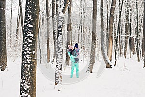 Happy family. Mother and child girl on a winter walk in nature.