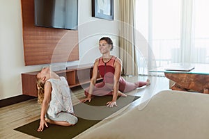 Happy Family. Mother And Childâ€™s Workout At Home. Little Girl And Young Woman Stretching Together In Living Room.