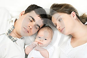 Happy family - mother, father and baby