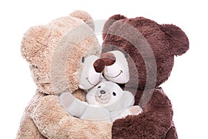 Happy family - mother, father and baby - concept with teddy bear