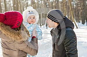 Happy family - Mother, father and child boy on a winter walk.