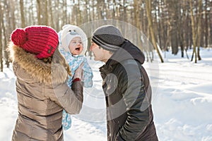 Happy family - Mother, father and child boy on a winter walk.