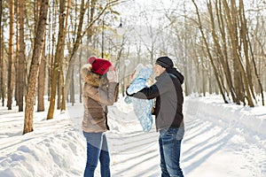 Happy family - Mother, father and child boy on a winter walk.