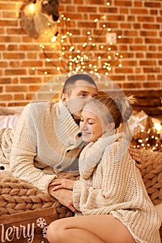 Happy family mother father and child on Christmas morning in bedroom playing and have a fun