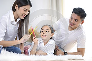 Happy family mother, father, child daughter at home