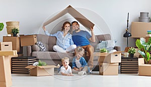 Happy family mother father and children move to new apartment an