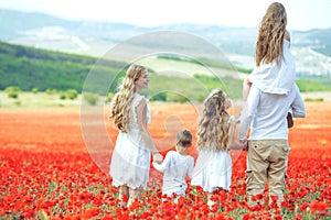 Happy family. Mother, father, children, son and daughter in nature.