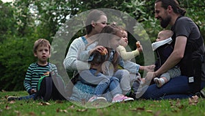 Happy family mother Father Three four Baby little siblings kids have fun blowing bubbles enjoying summer holidays in