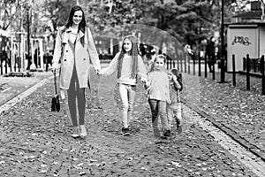 Happy family. mother of many children and three daughters child girl together, walking and joyfully laughing while