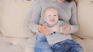 Happy family. mother playing with her baby