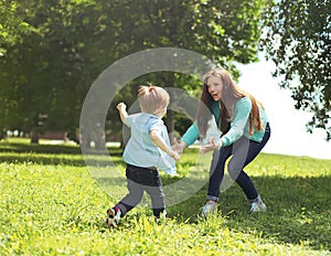 Happy family! Mother with son child playing having fun together