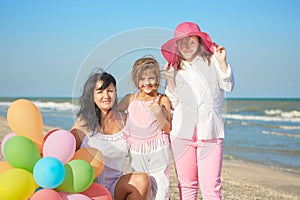 Happy family. Mother, youngest daughter and an seventeen-year-old daughter with Down syndrome.