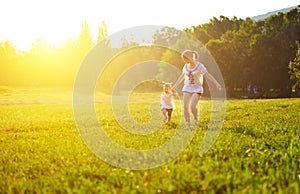 Happy family on nature walks in the summer