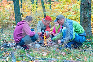 Happy family near a small bonfire