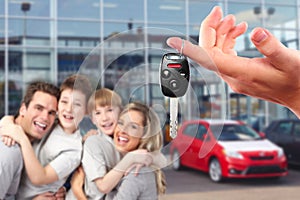 Happy family with a new car keys.