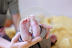 Happy family, newborn baby and older brothers, mom at home