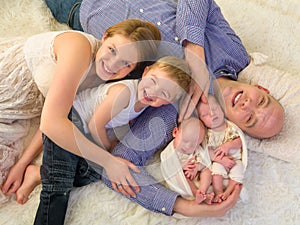 Happy family with newborn twins