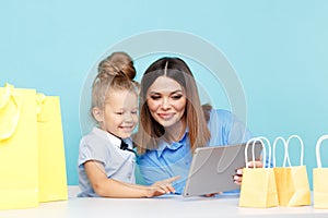 Happy family online shopping concept. Mom and child chooding things in internet isolated.