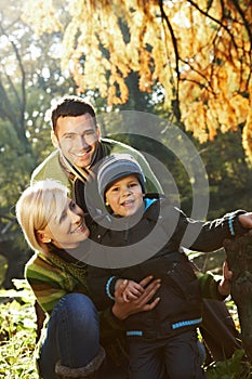 Happy family outdoor at autumn