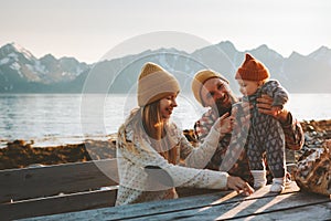 Happy family outdoor mother and father with baby