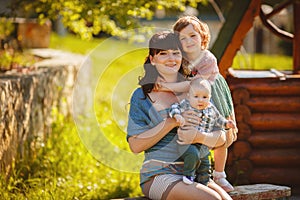 Happy family outdoors on the grass in the Park