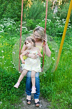 Happy family outdoors mother and kid, child, daughter smiling p