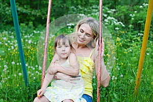 Happy family outdoors mother and kid, child, daughter smiling p