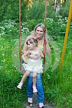 Happy family outdoors mother and kid, child, daughter smiling p