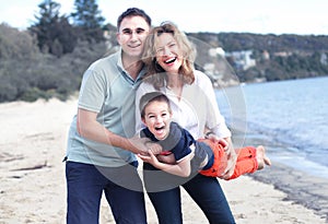 Happy family outdoors smiling