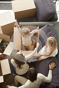 Happy family packing unpacking moving in out, vertical top view