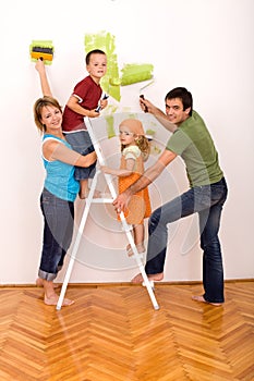 Happy family with painting utensils