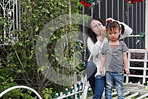 Happy family parental activity mother daughter hand in hand play and have fun outdoor in summer park child parent love girl