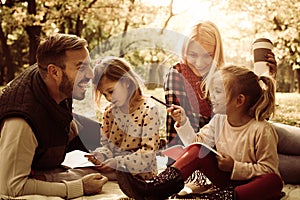 Happy family in park. Educate in nature.