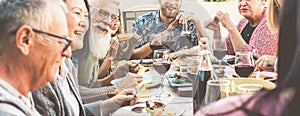 Happy family people having fun at barbecue dinner - Multiracial friends eating at bbq meal - Food, friendship, relationship and