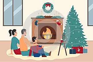 Happy family people sitting by xmas fireplace at home