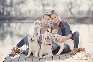 Happy family with Pets near the lake