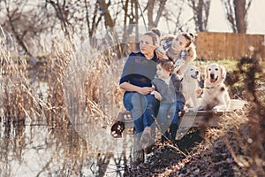 Happy family with Pets near the lake