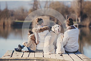 Happy family with Pets near the lake